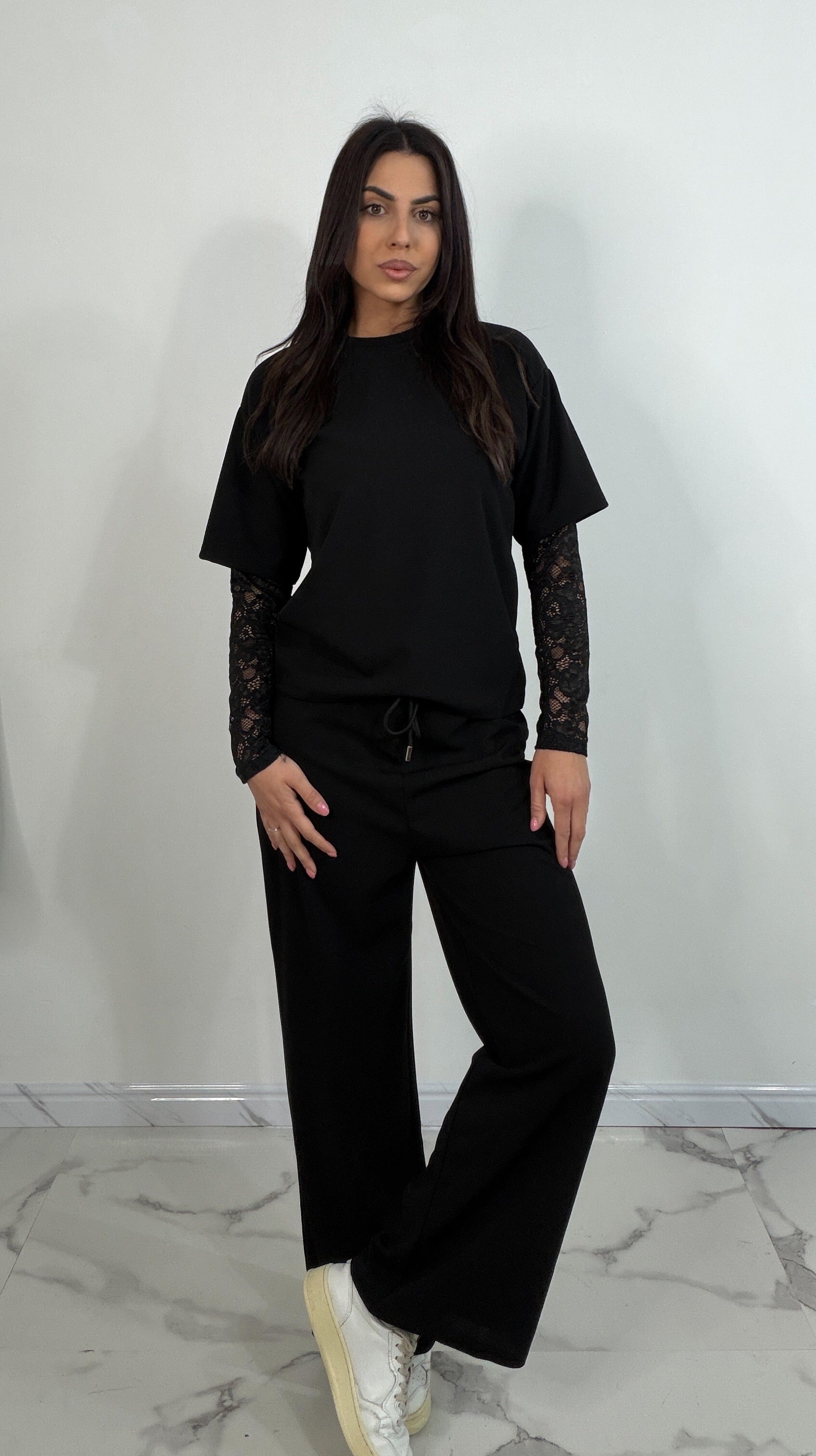 Completo tuta con pizzo