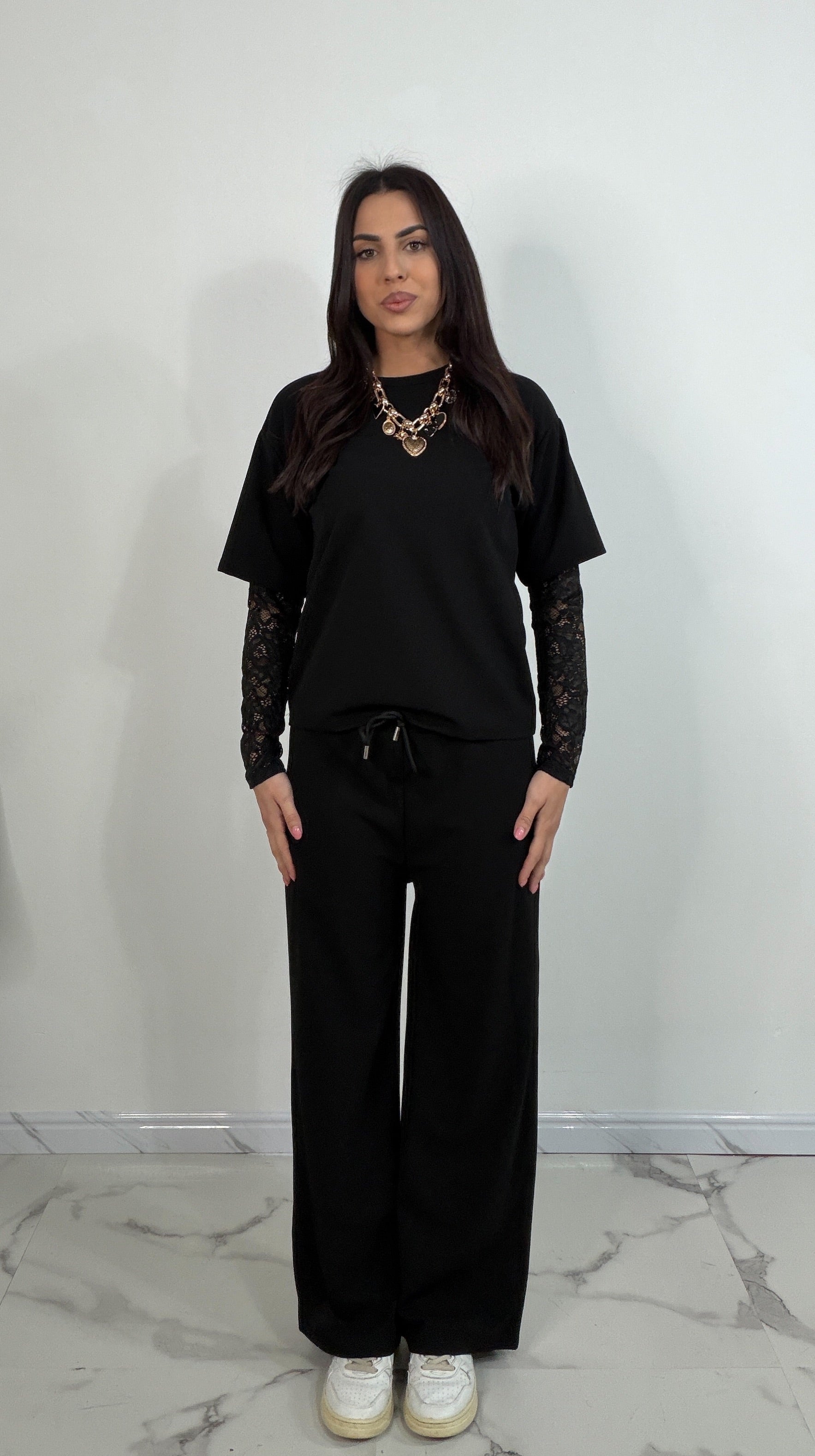 Completo tuta con pizzo